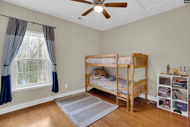 bedroom with hardwood / wood-style flooring and ceiling fan