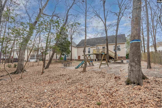 view of playground with a deck