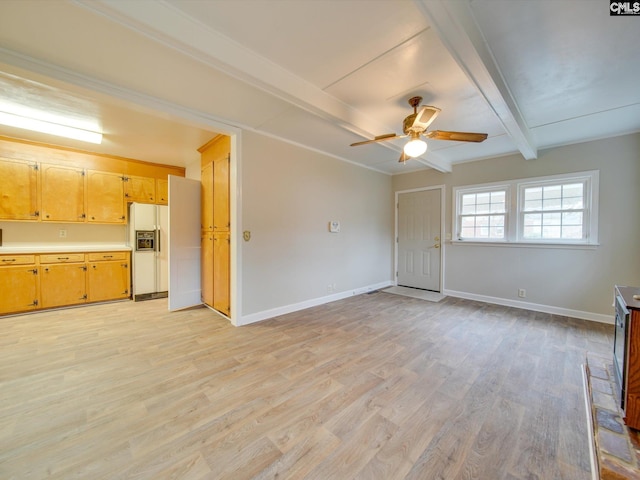 unfurnished living room featuring ceiling fan, light hardwood / wood-style floors, and beamed ceiling