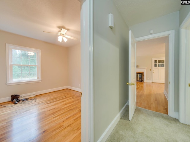 hallway with light colored carpet