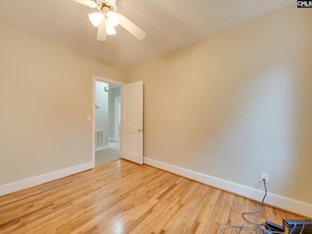 spare room featuring ceiling fan and light wood-type flooring