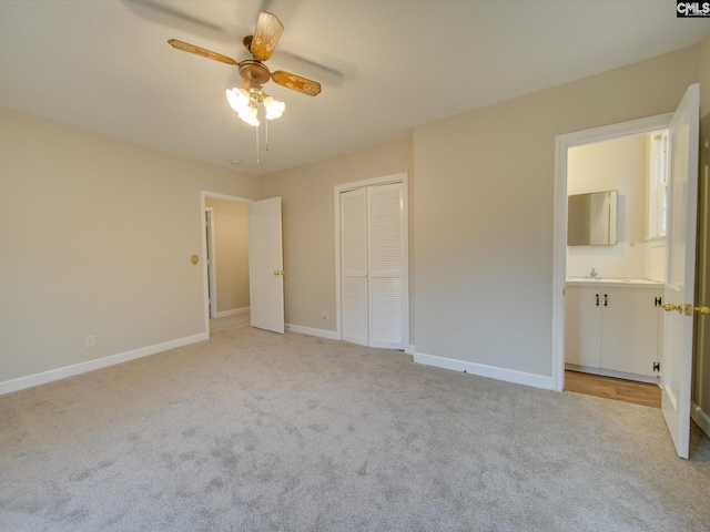 unfurnished bedroom featuring a closet, ceiling fan, and light carpet