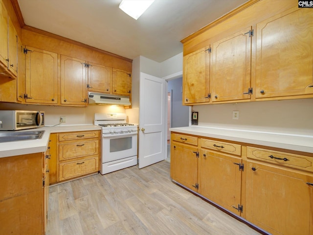 kitchen featuring light wood-type flooring and white range with gas cooktop