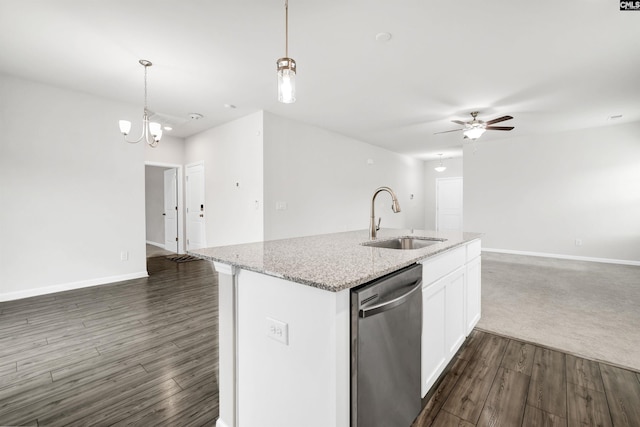 kitchen with dishwasher, hanging light fixtures, light stone counters, dark hardwood / wood-style floors, and white cabinets