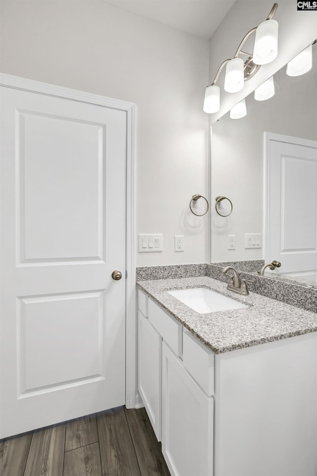 bathroom featuring hardwood / wood-style floors and vanity