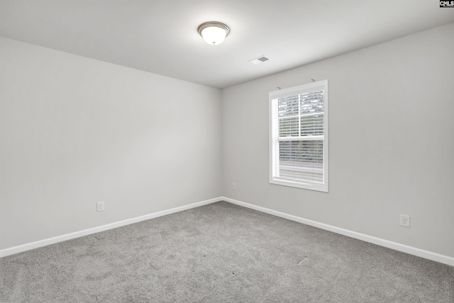 unfurnished room featuring carpet flooring