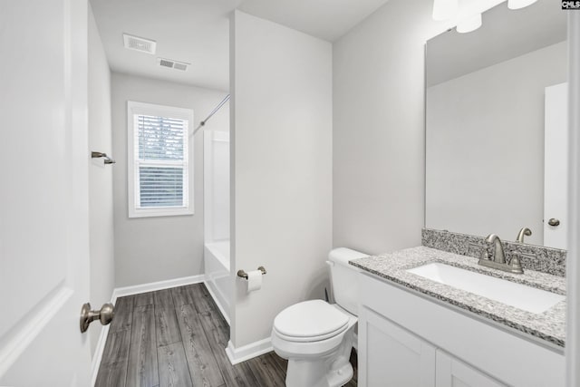 full bathroom with shower / tub combination, toilet, vanity, and wood-type flooring