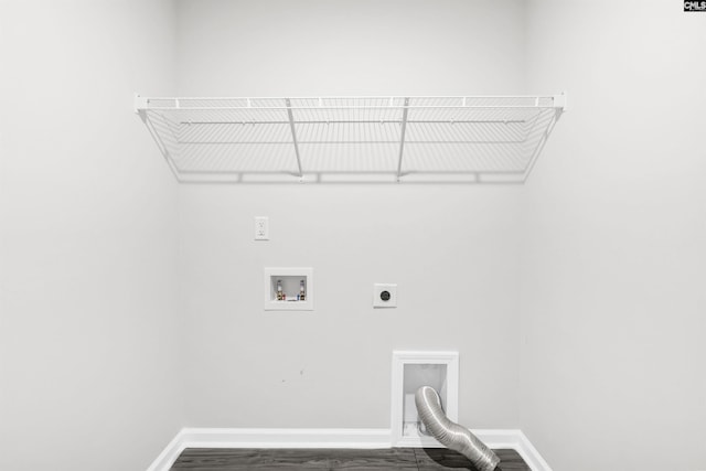 laundry area featuring dark wood-type flooring, hookup for a washing machine, and hookup for an electric dryer