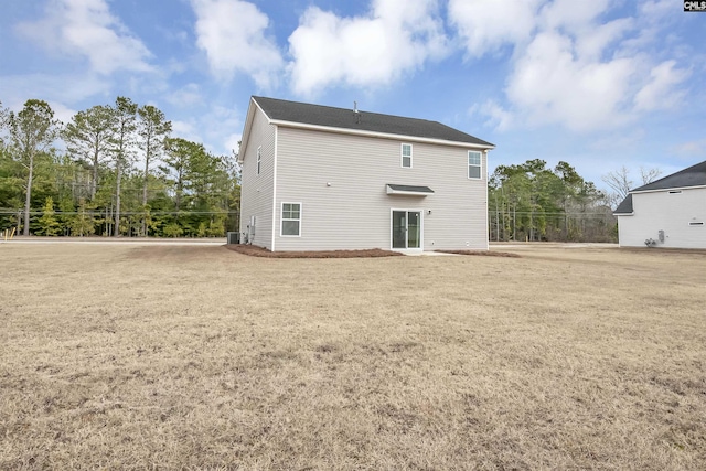 back of house with a yard