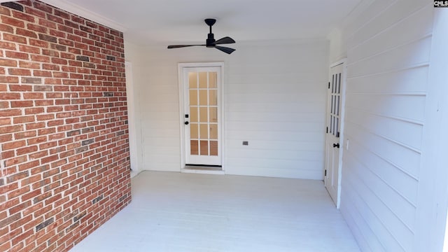 entrance to property with ceiling fan