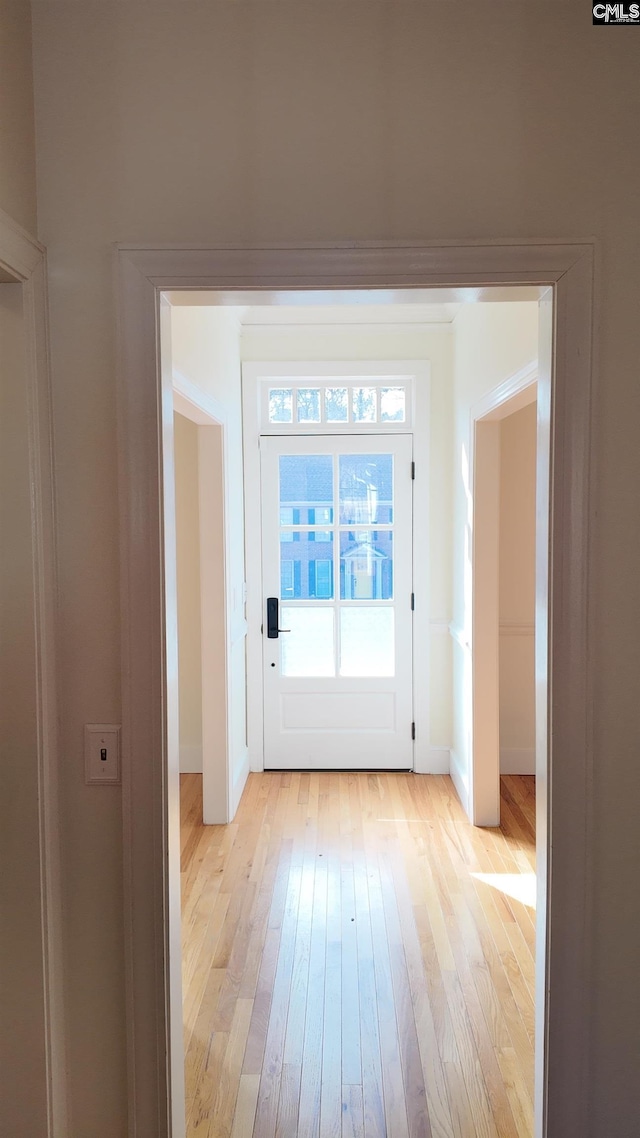 doorway with light wood-type flooring