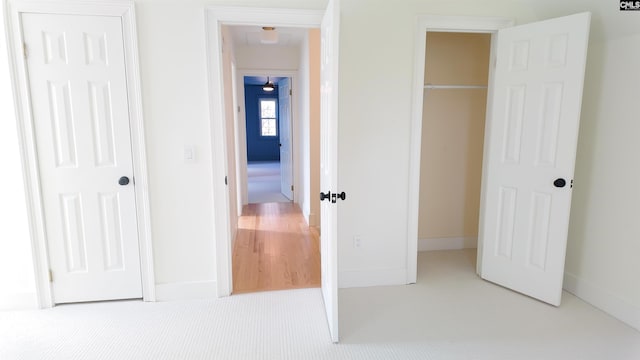 unfurnished bedroom with light carpet