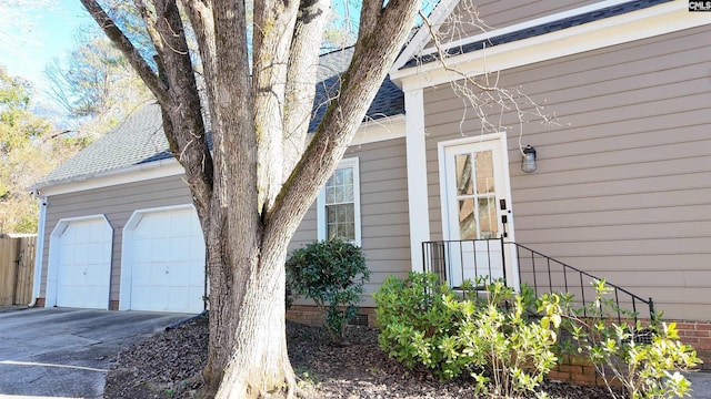 view of property exterior featuring a garage