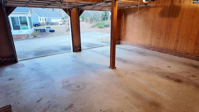 garage featuring wooden walls