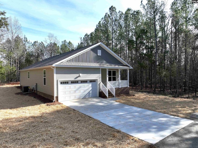 view of front of home featuring central AC and a garage