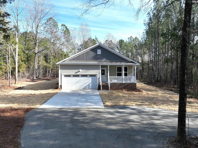 view of front of home with a porch and a garage