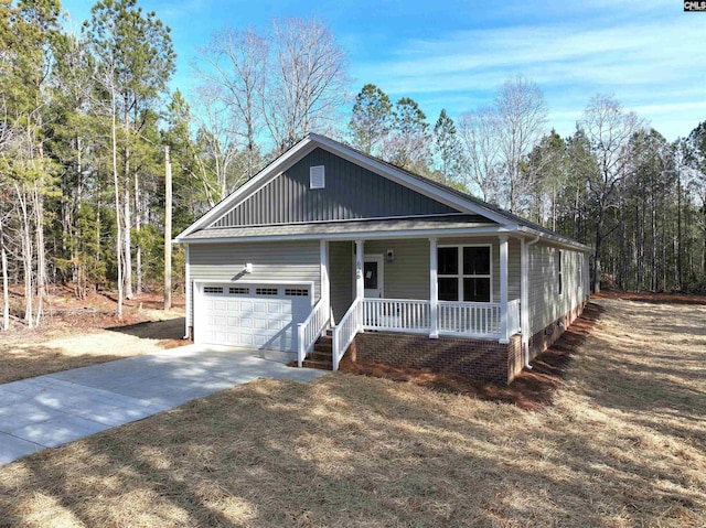 view of front facade with a garage and covered porch