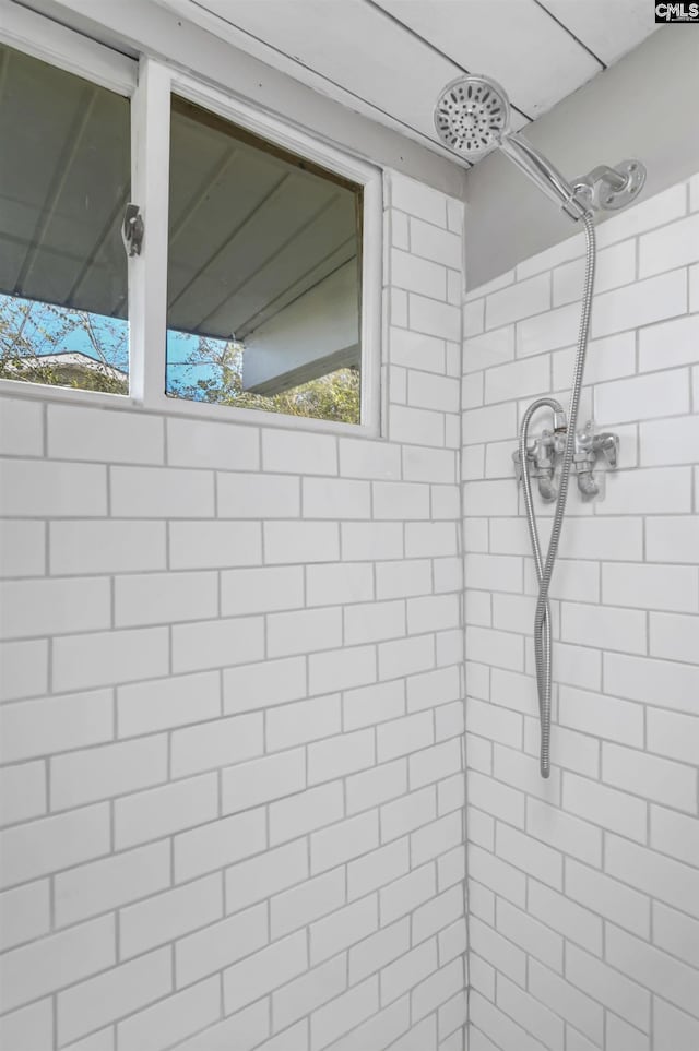 bathroom with a tile shower