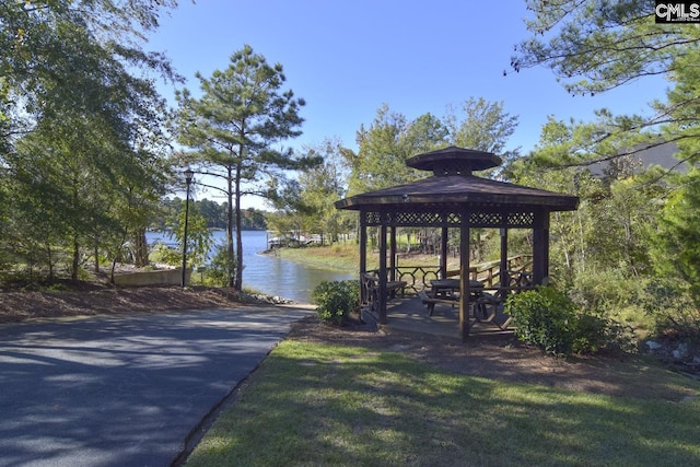 dock area with a water view and a gazebo