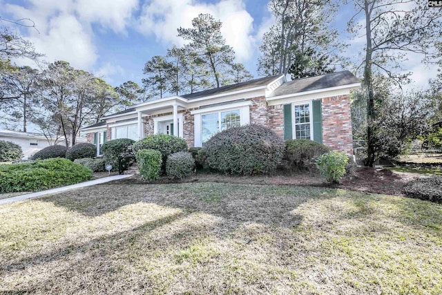 ranch-style house with a front yard