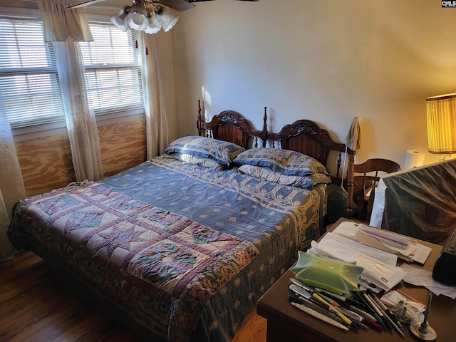 bedroom with hardwood / wood-style floors and ceiling fan