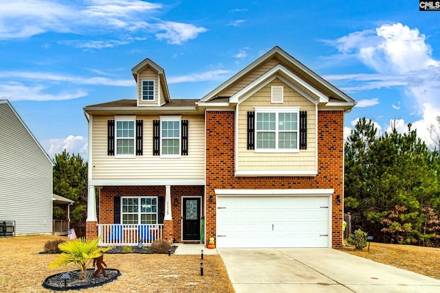 view of front of home featuring covered porch and a garage