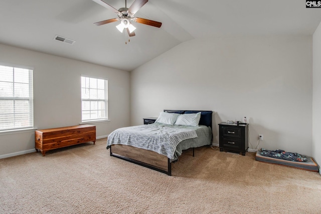 carpeted bedroom featuring lofted ceiling and ceiling fan