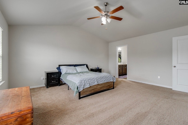 carpeted bedroom featuring ensuite bathroom, ceiling fan, and vaulted ceiling