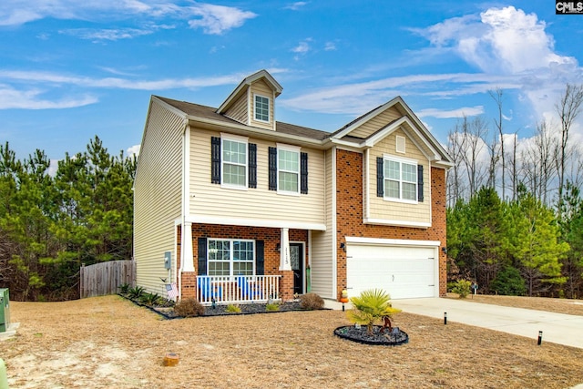 view of front of house with covered porch and a garage