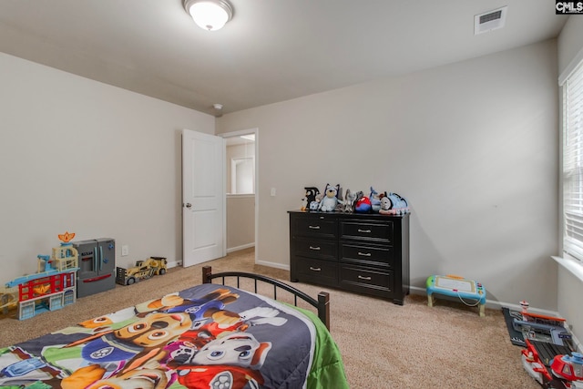 bedroom with light carpet