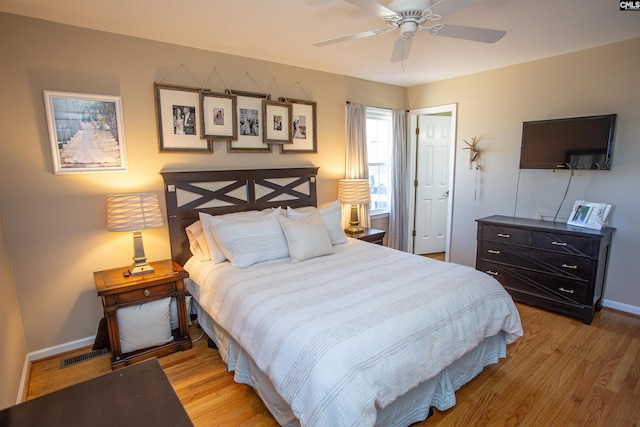 bedroom with light wood-type flooring and ceiling fan