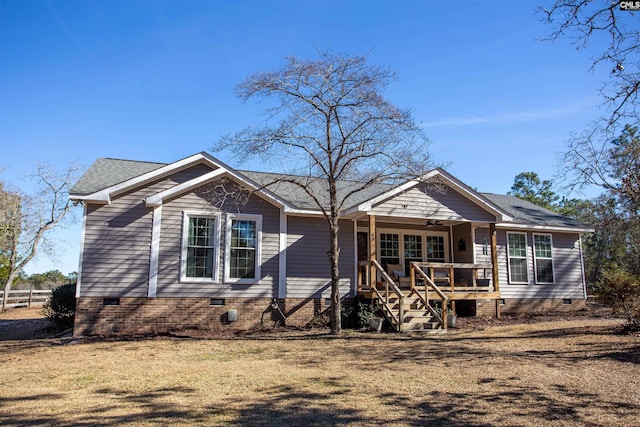 view of front of house featuring a front yard and a porch