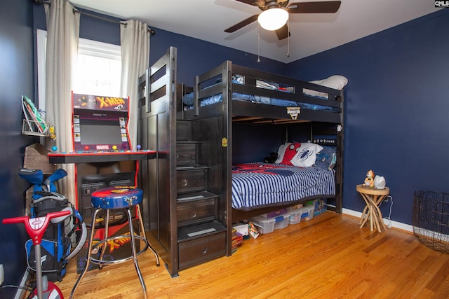 bedroom with ceiling fan and hardwood / wood-style floors