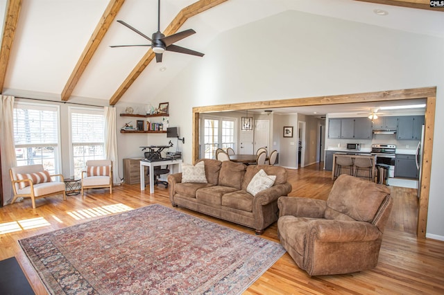 living room with high vaulted ceiling, light wood-type flooring, french doors, and beamed ceiling