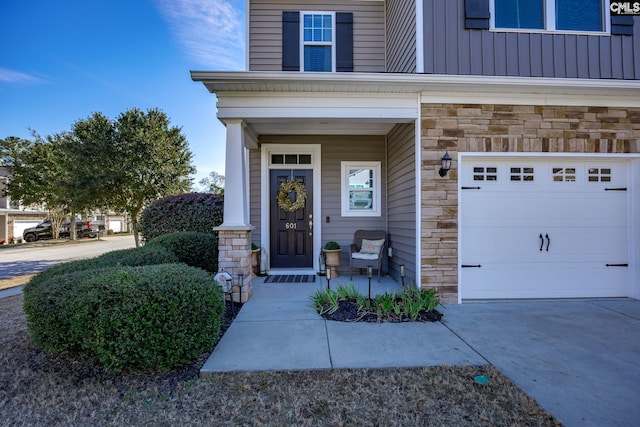 entrance to property with a porch and a garage