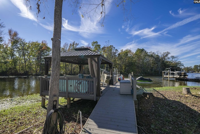 dock area featuring a gazebo and a water view