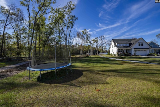 view of yard with a trampoline