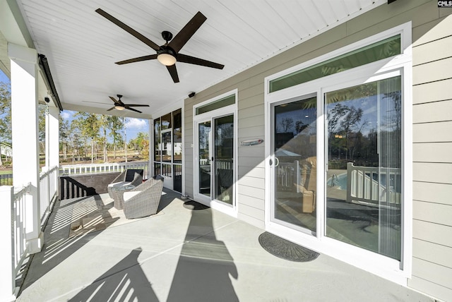 view of patio / terrace with ceiling fan and a porch