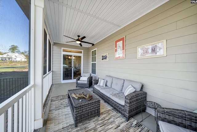 sunroom / solarium featuring ceiling fan