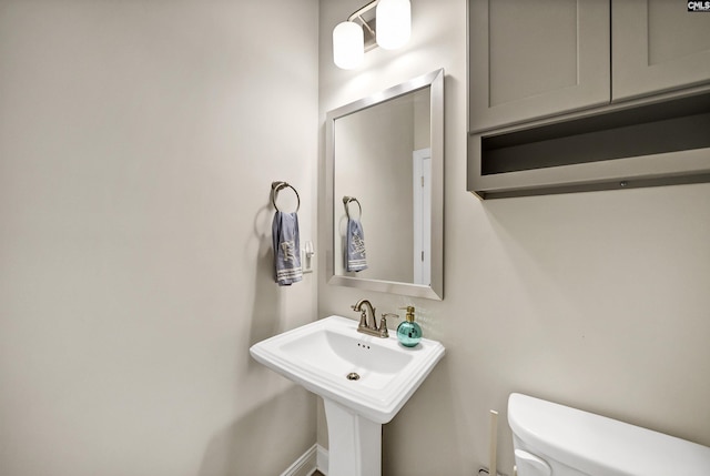 bathroom with toilet and sink