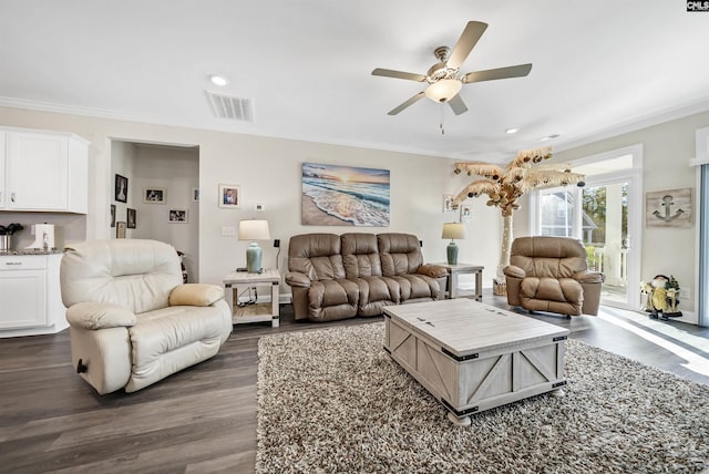 living room with ceiling fan, crown molding, and dark hardwood / wood-style floors