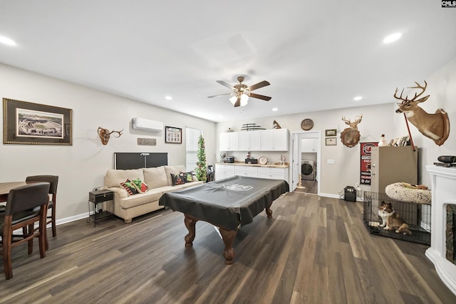 recreation room with washer / clothes dryer, an AC wall unit, ceiling fan, dark hardwood / wood-style flooring, and billiards