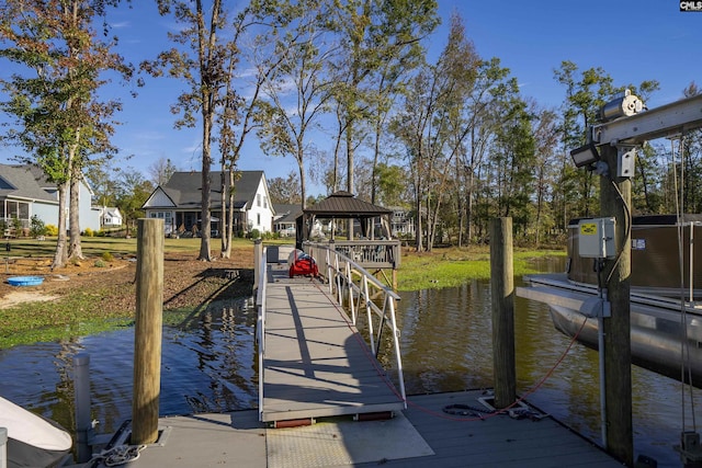 dock area featuring a gazebo and a water view