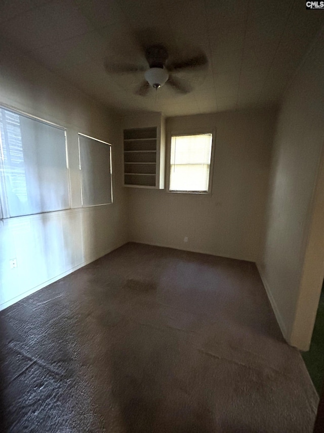 unfurnished room featuring carpet floors and ceiling fan