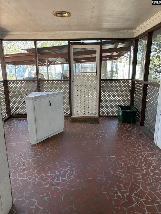 unfurnished sunroom with a wealth of natural light