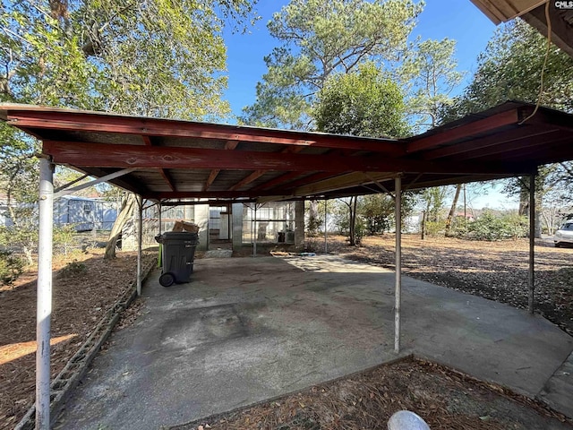 view of vehicle parking featuring a carport