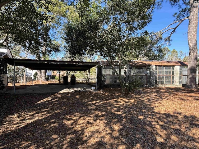 rear view of property with a carport