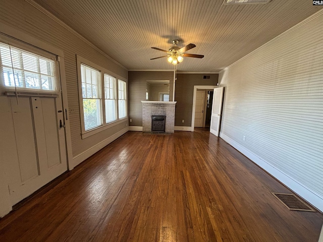 unfurnished living room featuring ceiling fan, crown molding, and dark hardwood / wood-style floors