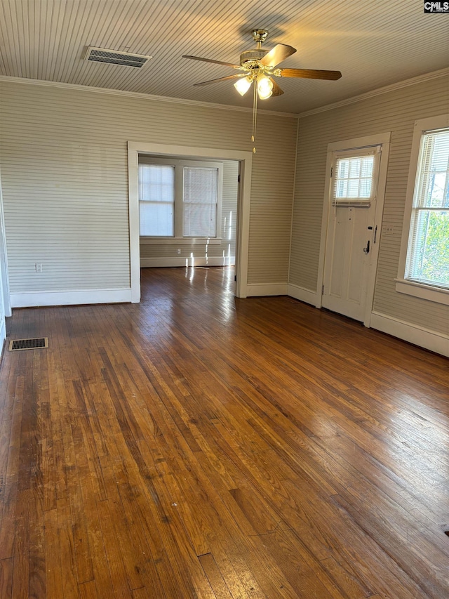 interior space featuring ceiling fan, dark hardwood / wood-style flooring, and crown molding