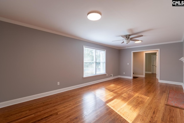 spare room with ceiling fan, light hardwood / wood-style floors, and crown molding